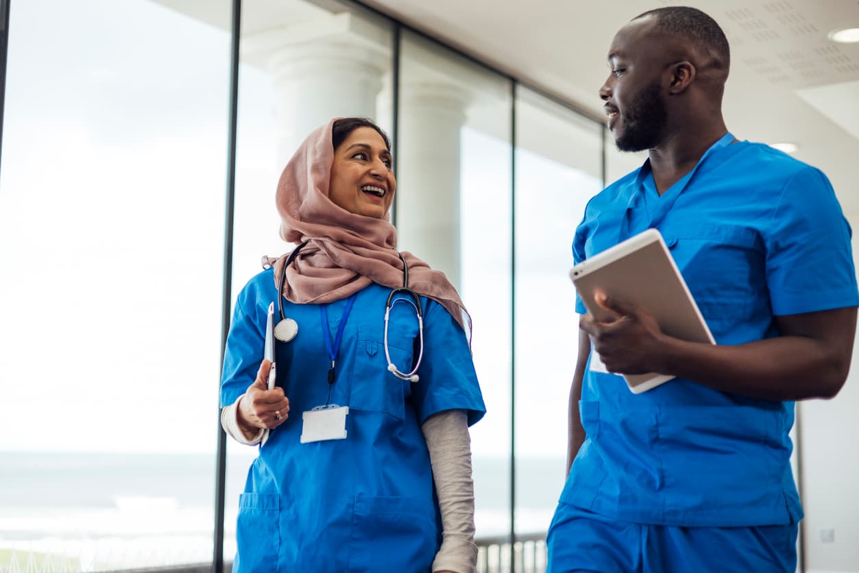 Healthcare professionals walking down corridor