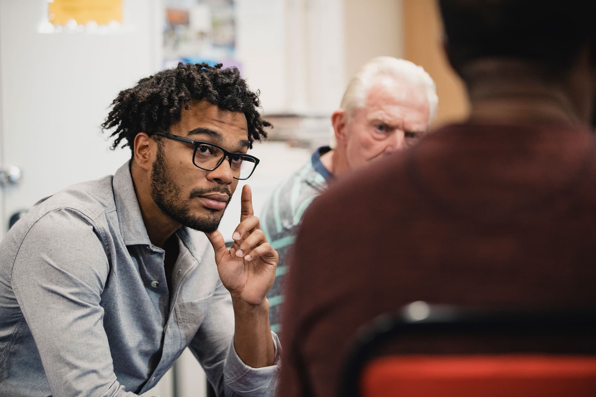 men talking in a group