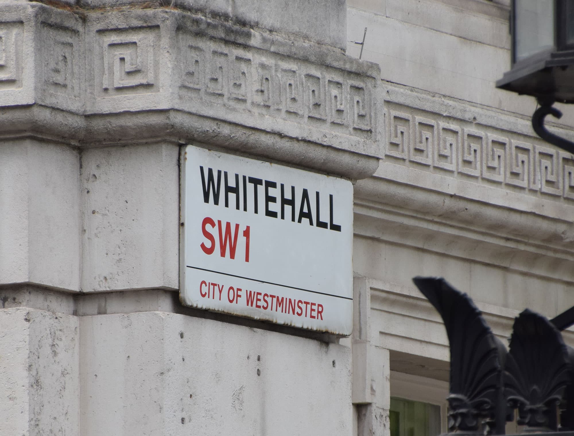Whitehall road sign displaying SW1