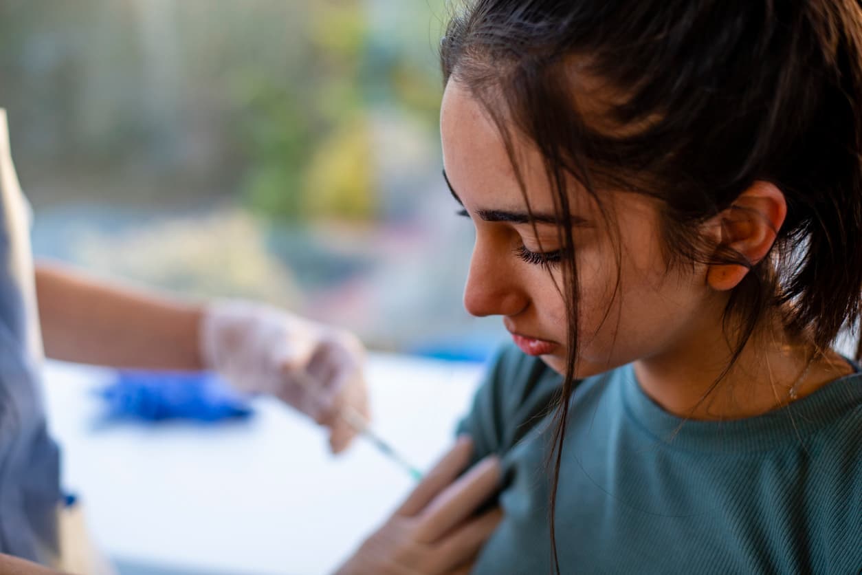 Girl receiving vaccination